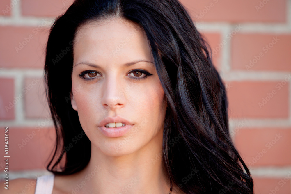 Beautiful brunette woman looking at camera Beautiful brunette woman looking at camera