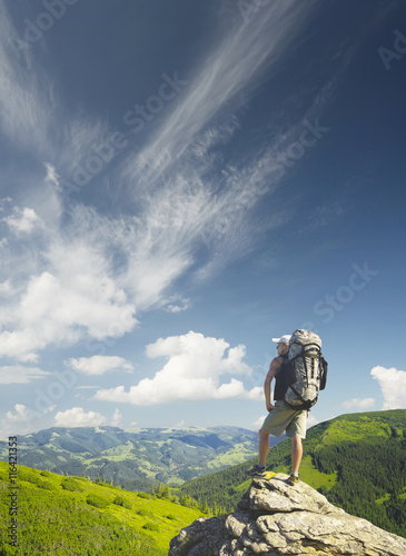 Tourist on the rock. Sport and active life concept