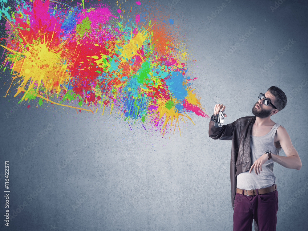 Hipster guy with camera and paint splash Hipster guy with camera and paint splash