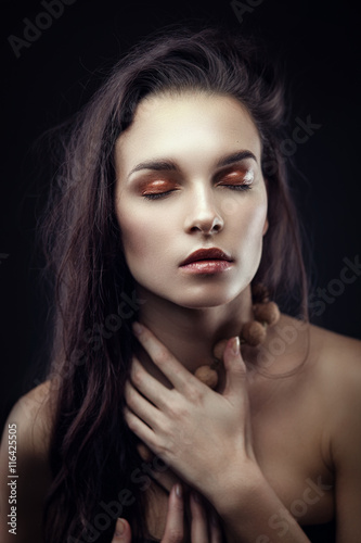 Fashion beauty portrait of brunette with chaos hairstyle