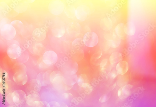 Abstract photo of backlight reflector and glitter bokeh lights background. Image is blurred and made with colorful filters.