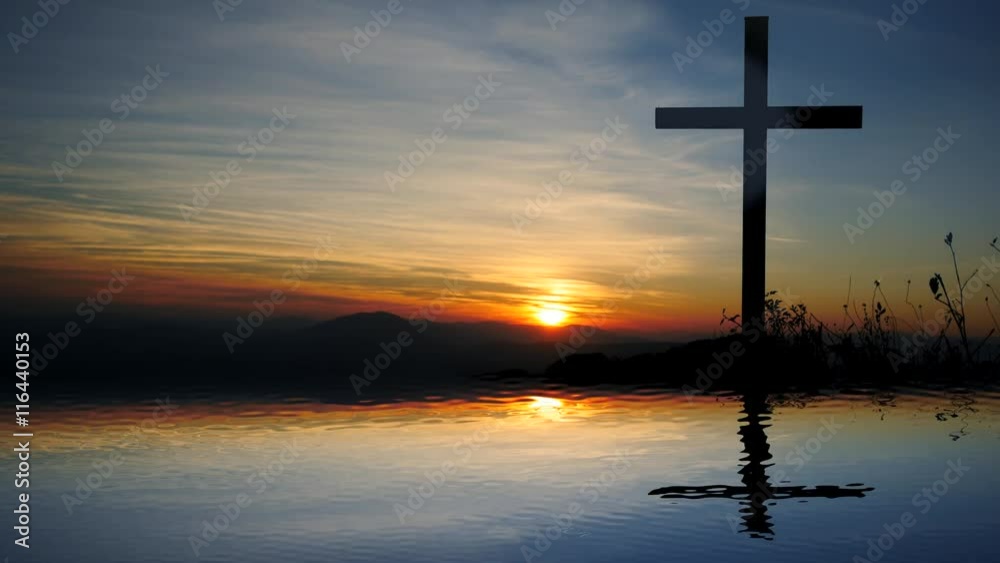 water reflection of religious cross in landscape at sunset water reflection of religious cross in landscape at sunset