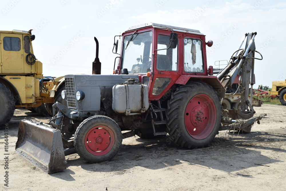 Tractor, standing in a row. Agricultural machinery. Tractor, standing in a row. Agricultural machinery.