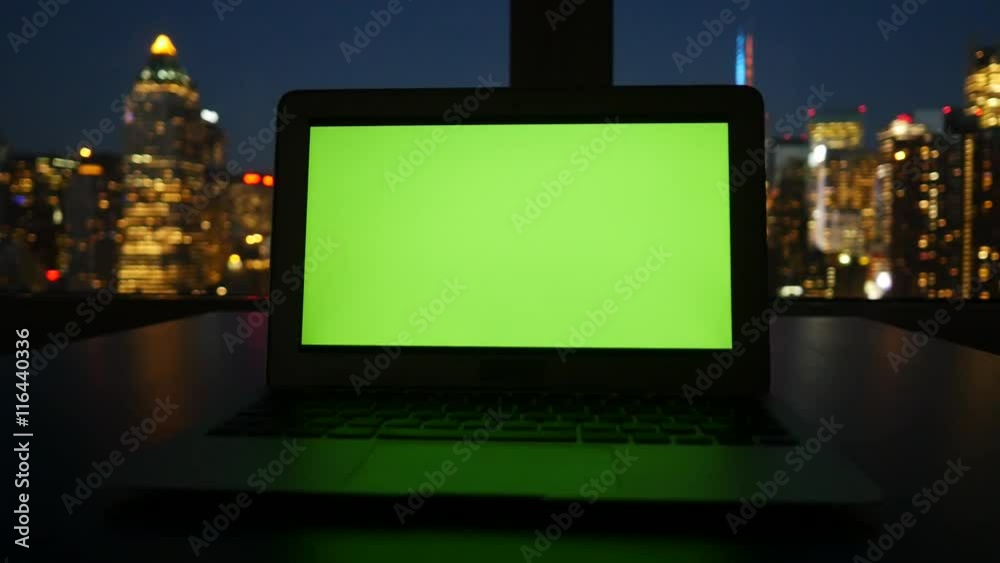 isolated green screen on laptop computer display. modern office desk table view isolated green screen on laptop computer display. modern office desk table view
