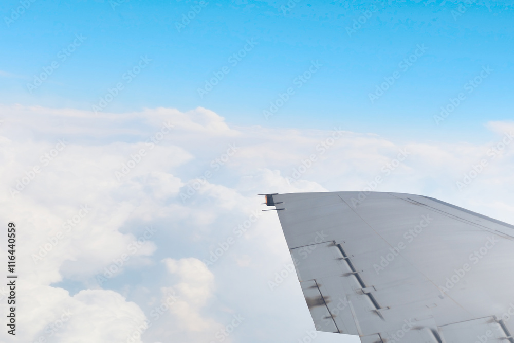 Fototapeta premium Airplane wing out of window . Mixed media