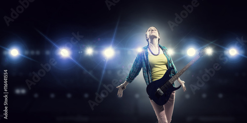 Female rock guitarist . Mixed media