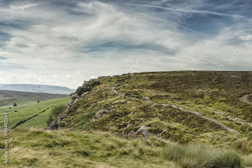 Magnificent landscape of rock formations and moorland at Stanage Edge in the Peak District in Derbyshire, a stunning area of great natural beauty covering 555 square miles across central England photo