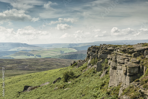 Magnificent landscape of rock formations and moorland at Stanage Edge in the Peak District in Derbyshire, a stunning area of great natural beauty covering 555 square miles across central England photo