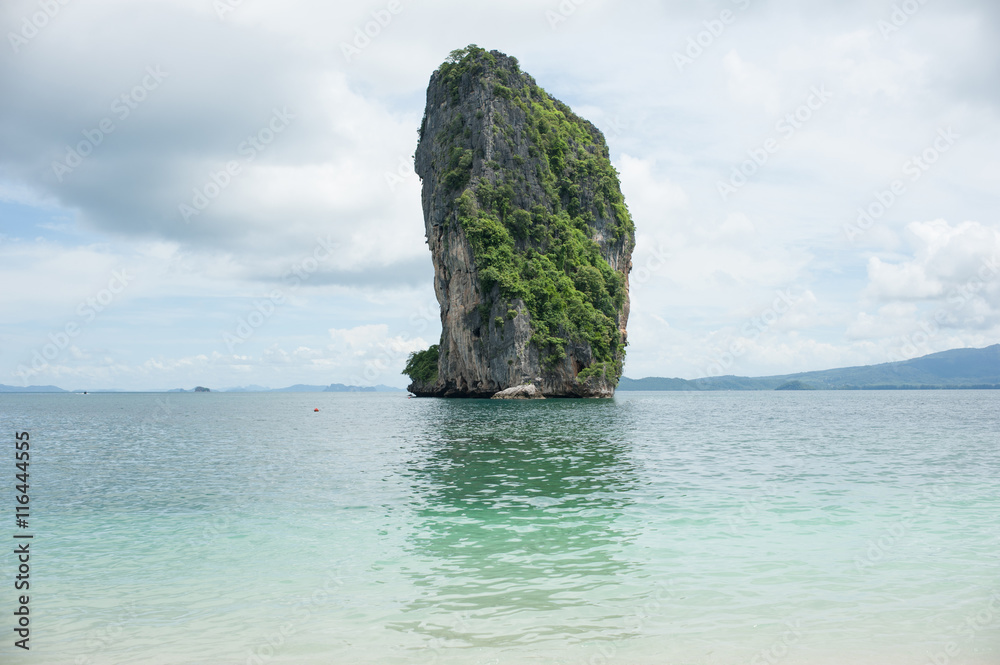 Poda Island, Speed boats and Thai traditional boat anchored in a amazing blue water beach in Krabi, Thailand.