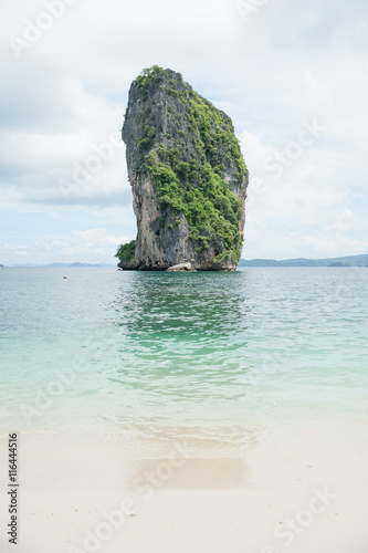 Poda Island, Speed boats and Thai traditional boat anchored in a amazing blue water beach in Krabi, Thailand.