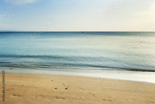 sand beach and peaceful waves