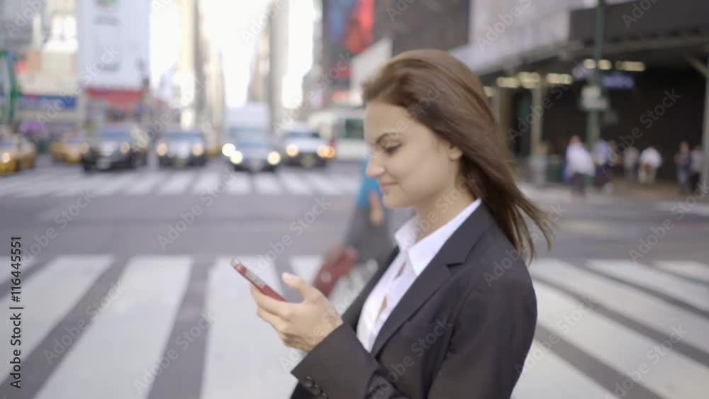 attractive business women using smart phone in the city commuting to work attractive business women using smart phone in the city commuting to work