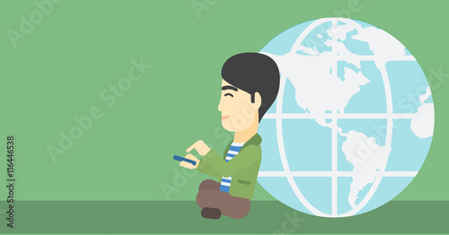 Businessman sitting near Earth globe.