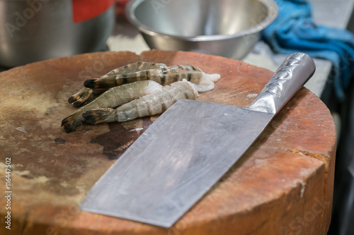 raw black tiger prawn on wood plate 