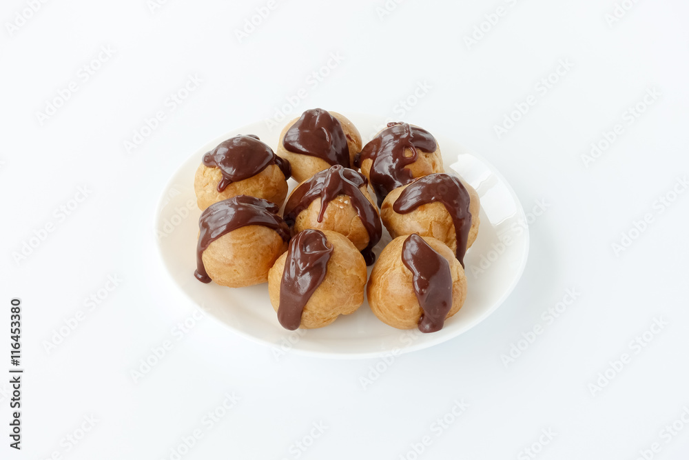 Profiteroles garnished with chocolate sauce Profiteroles garnished with chocolate sauce