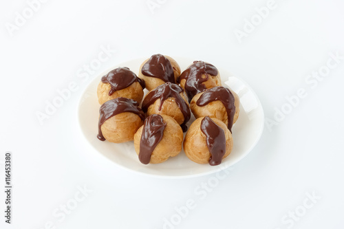 Profiteroles garnished with chocolate sauce