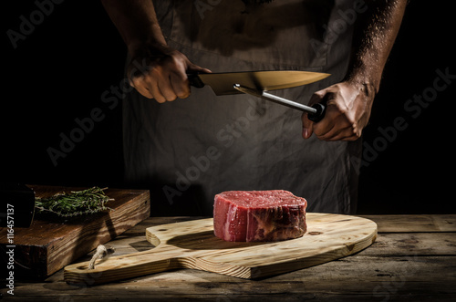 Chef butcher prepare beef steak