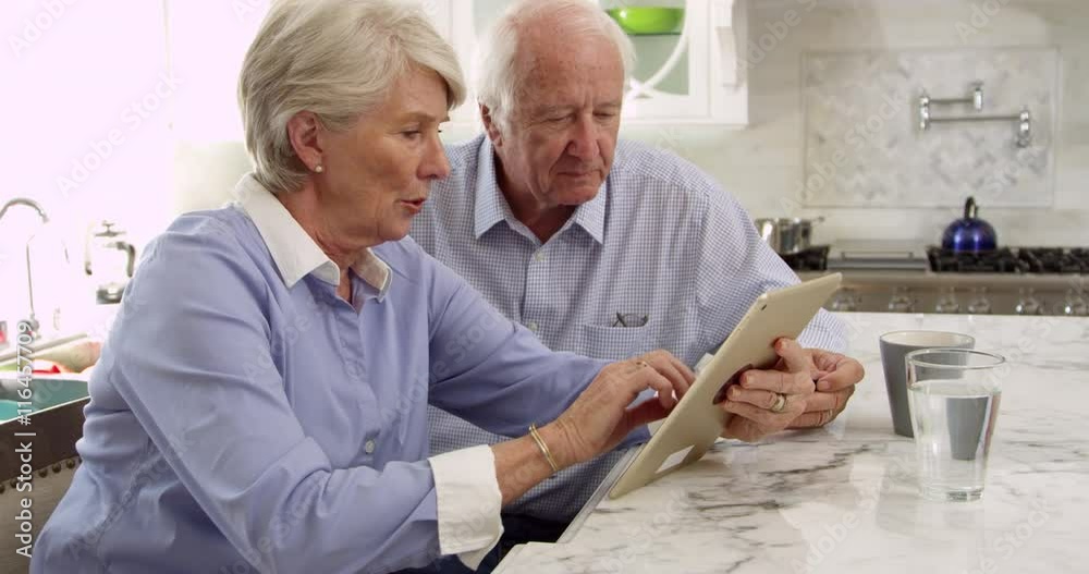 Senior Couple Use Digital Tablet For Purchase Senior Couple Use Digital Tablet For Purchase
