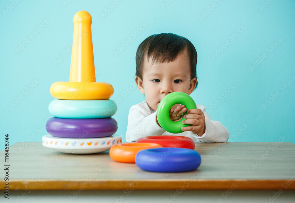 kid boy playing with building blocks at home or kindergarten kid boy playing with building blocks at home or kindergarten