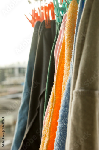 clothes hanging to dry on a laundry line and sun shining