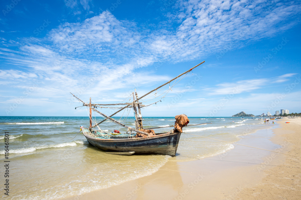 Old fishing boat and deep bluesky background at Hua Hin beach, Prachuap Khiri Khan Province, Thailand. Old fishing boat and deep bluesky background at Hua Hin beach, Prachuap Khiri Khan Province, Thailand.