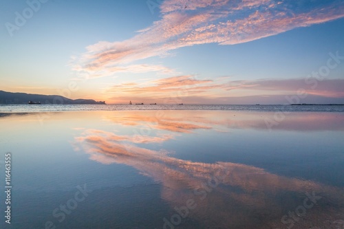 Fototapeta Naklejka Na Ścianę i Meble -  Reflection Sunrise or Sunset View With Orange Cloud and Blue Sky