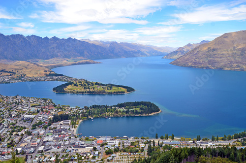Scenic view of Queenstown and surrounding rugged mountain range (The Remarkables) on the shores of the glacial Lake Wakatipu, New Zealand photo