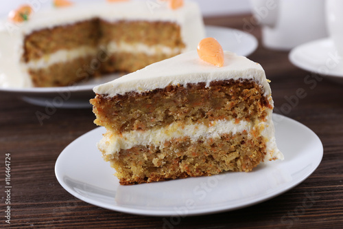 Delicious carrot cake on wooden table