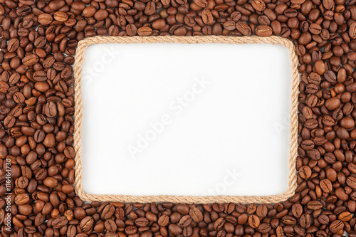 Frame made of rope with coffee beans and a white background