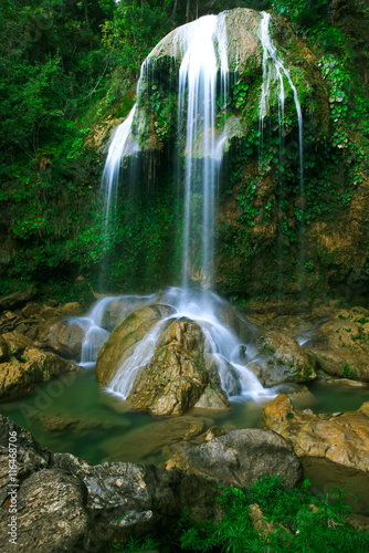 Waterfall in a lush rainforest. Vegas grande waterfall in Topes de Collante, Trinidad, Cuba