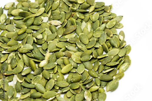 Pumpkin seeds on a white background.