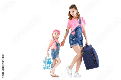 woman and child with a suitcase