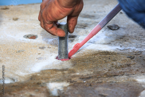 Injection adhesive chemical into hole for preparation anchor bolt