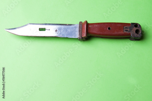 The image of unting knife on agreen background photo