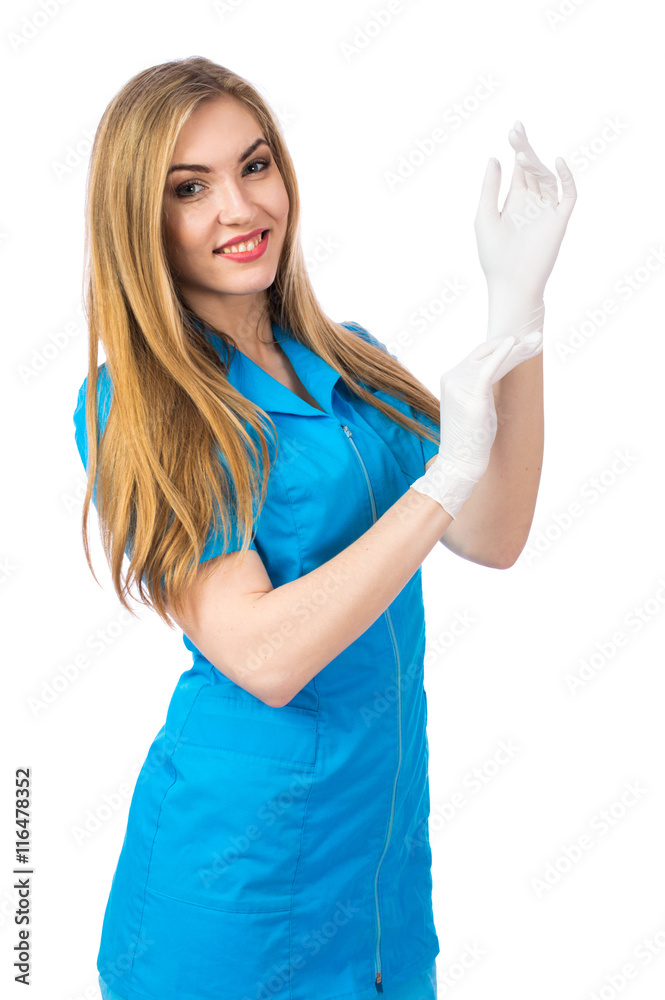 Young blonde woman doctor wearing rubber gloves, isolated on white background Young blonde woman doctor wearing rubber gloves, isolated on white background