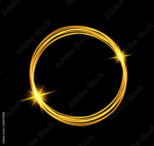 Magic light energy circle. Glowing fire ring trace. Glitter sparkle swirl trail effect on black background.