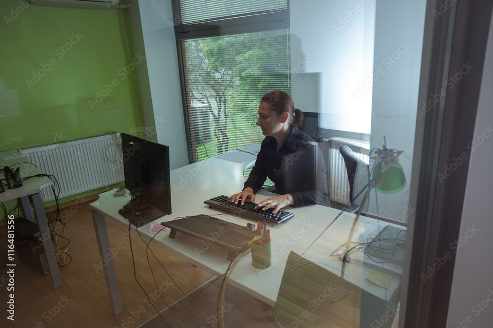 Mid adult woman with headset, working in call center Mid adult woman with headset, working in call center