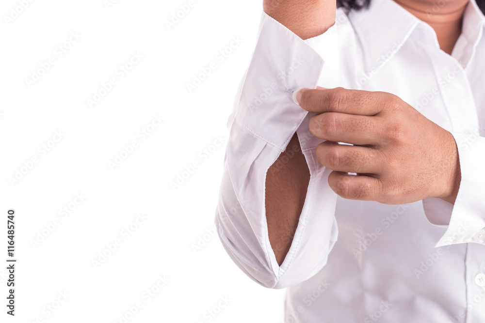 Hand of woman holding cufflinks isolated on white background