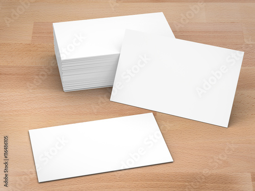 stack of blank name cards on wooden background