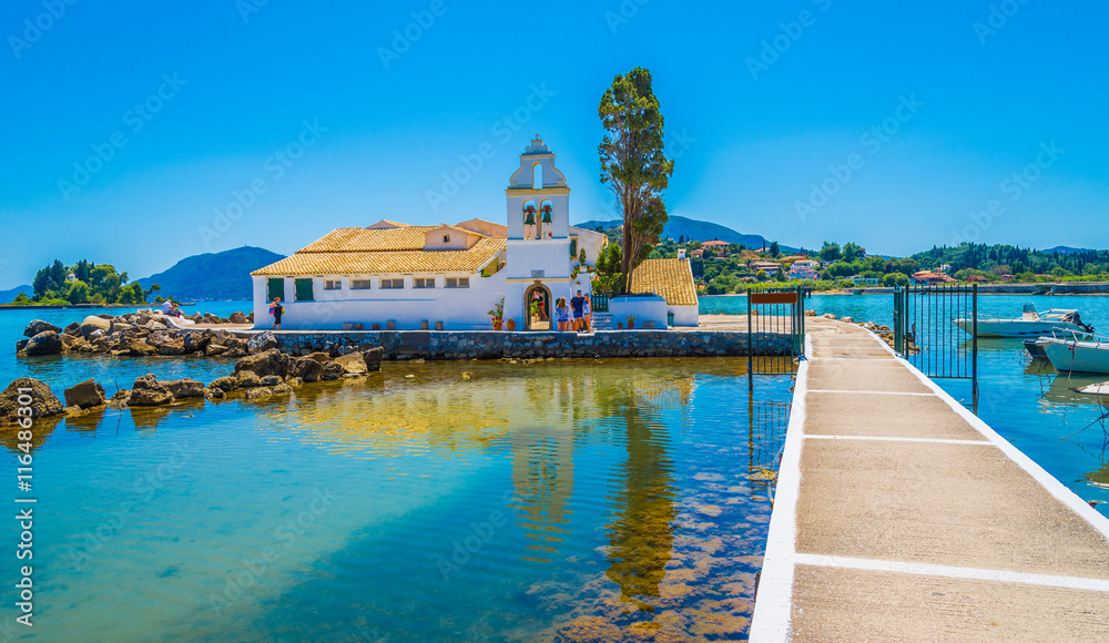 Landscape of religious architecture of Vlacherna monastery of Panay region in Corfu village, Greece - obrazy, fototapety, plakaty 