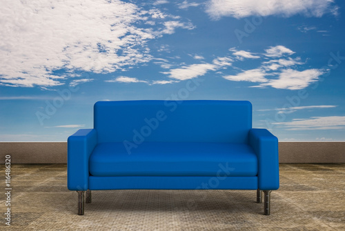 blue sofa with blue sky background © phonlamaiphoto