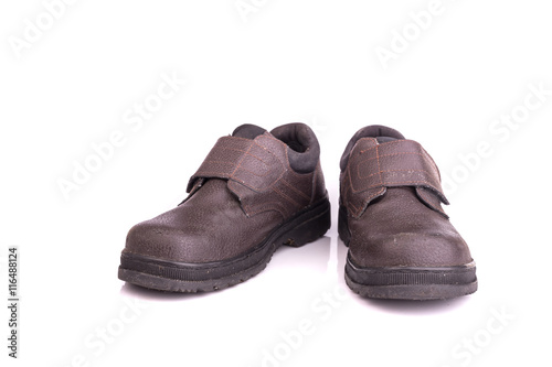 Old black safety shoe isolated on white background