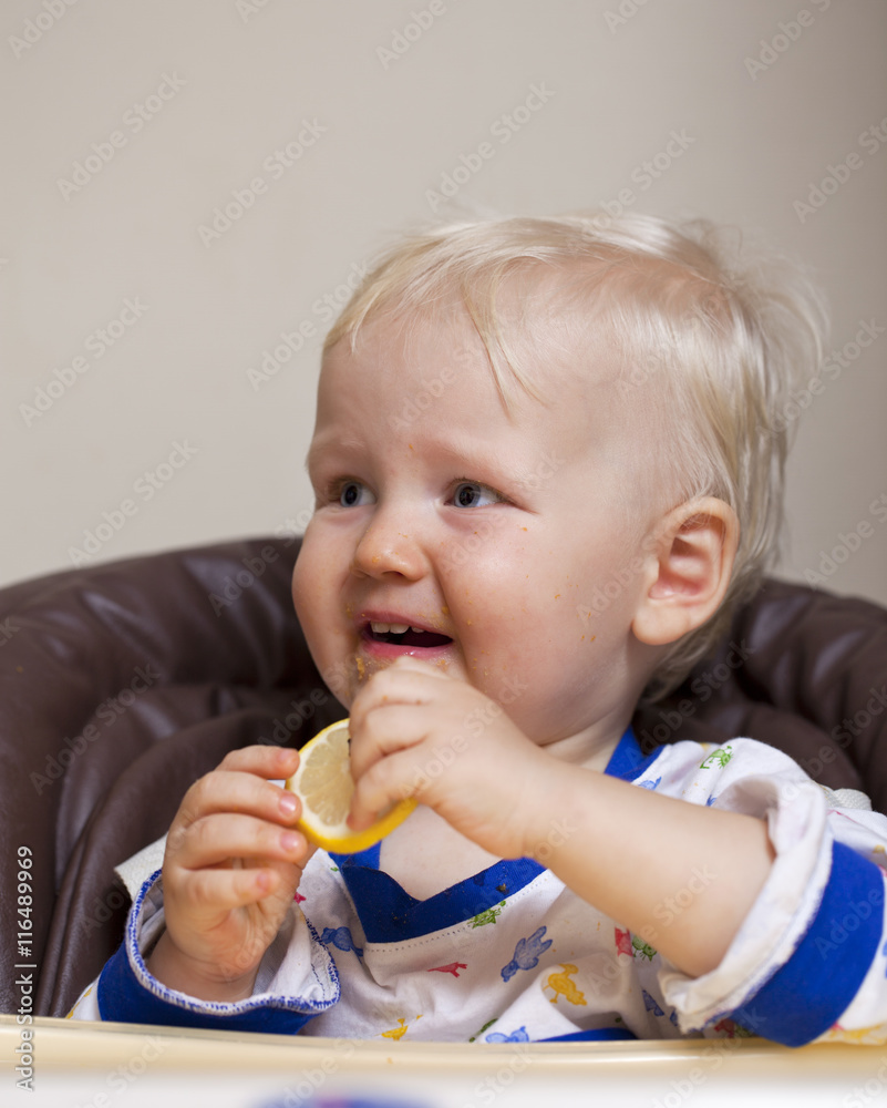 Two year baby boy sitting at the dinner table Two year baby boy sitting at the dinner table