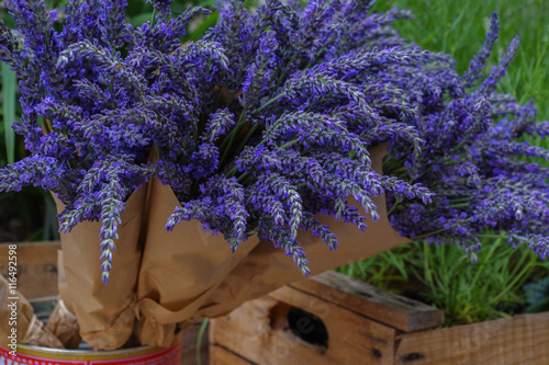 Bunch of lavender in craft paper. Violet flowers. photo