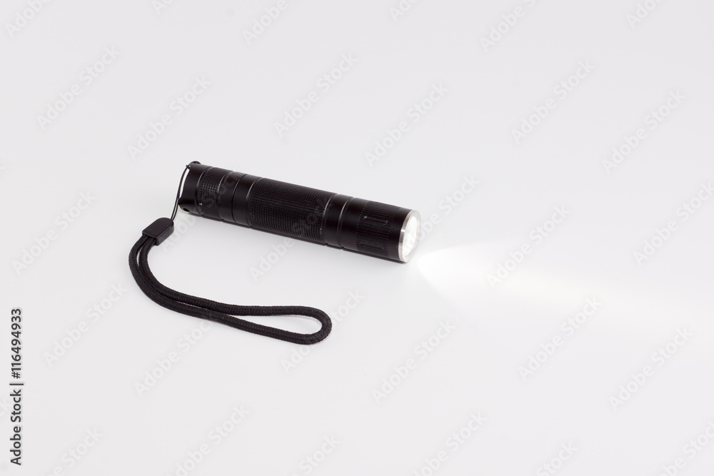 working flashlight on a white background