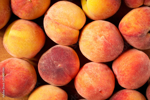 Fresh ripe peaches background, close-up