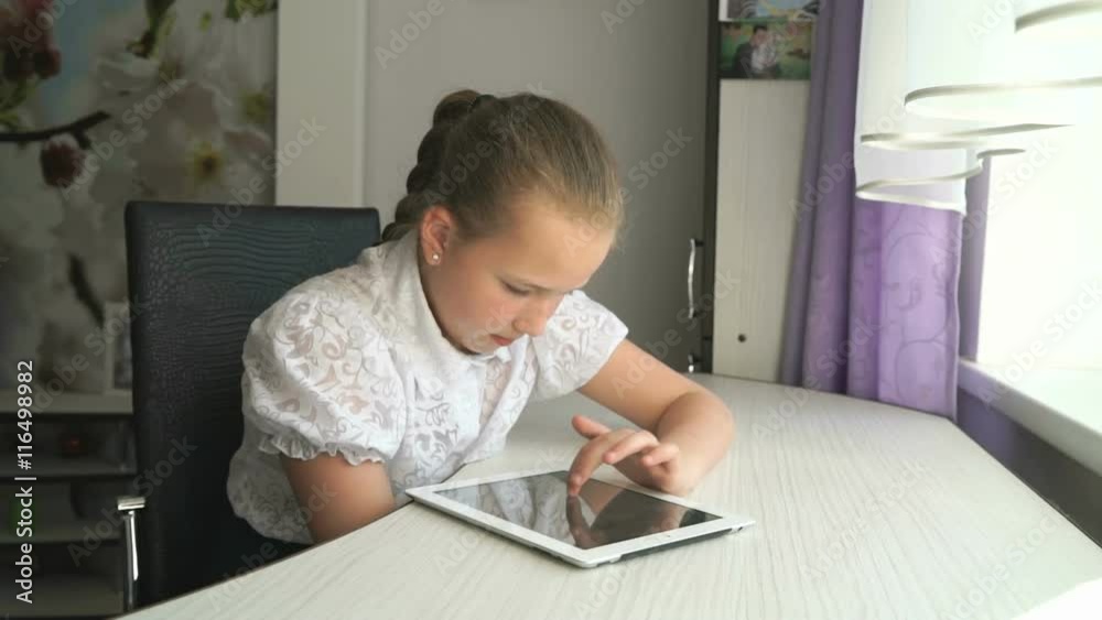 Teenager girl holding a digital tablet computer Teenager girl holding a digital tablet computer