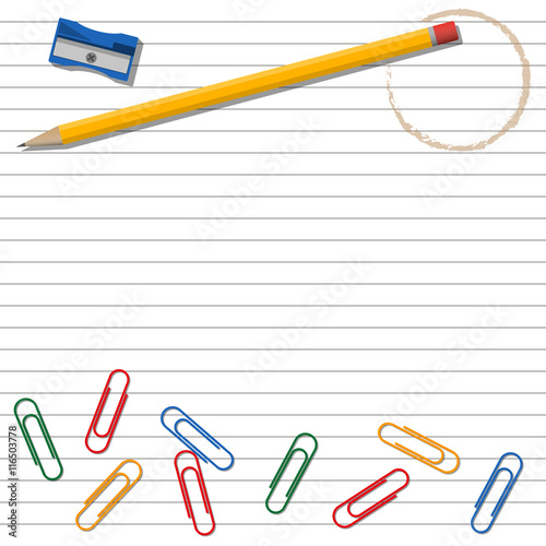 Office supplies on lined background.