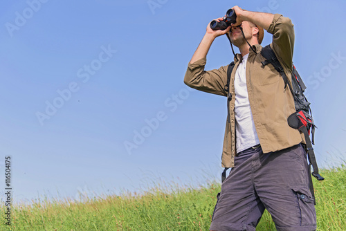 Young male tourist searing for location