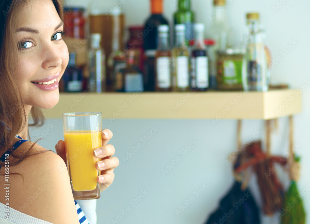 Portrait of a pretty woman holding glass with tasty juice